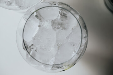 Ice in a glass of wine prepared for a special cocktail for a bartender's bar or restaurant.