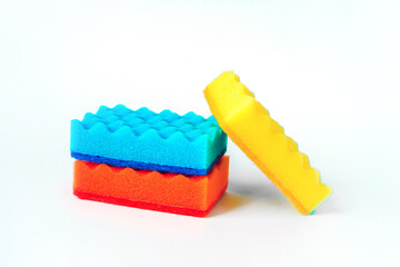 Colored dish washing sponges on an isolated white background