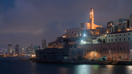 Fototapeta na wymiar Tel Aviv-Yafo, Israel - July 06, 2020: Night Jaffa and Tel Aviv skyline. Ancient city and port