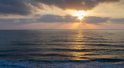 Seascape: sunset over water surface. Aerial view