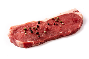 beef steak garnished with pepper isolated on white background