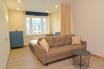 Living room-bedroom with metal coffee table. Residential zoning