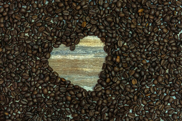 Heart symbol made of coffee beans on a wooden surface. Welcoming the day of love, February 14, Valentine Day.