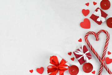 White background with gifts and hearts and lollipops. Layout for Valentine's Day