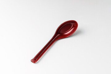 Plastic spoon on white background