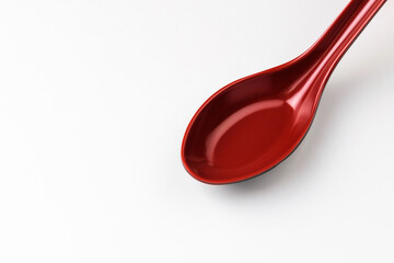 Plastic spoon on white background