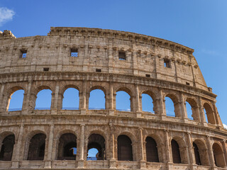 Obraz premium Detail of Colosseum or gladiator Arena famous stony ancient architecture. Arches of Flavian Amphitheatre. Construction of antique Roman Empire. Arena Flavio or Coliseum, iconic symbol of Imperial Rome