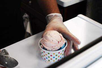 Serving Strawberry Ice Cream at Ice Cream Shop
