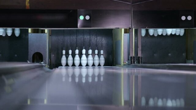 Bowling ball roll and hit the pins