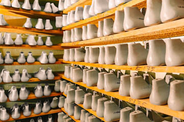 Blanks or pads for shoes are on the shelves in the cabinet in the shoe plant.