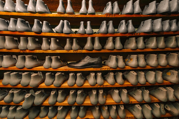 Blanks or pads for shoes are on the shelves in the cabinet in the shoe plant.