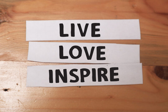 Live love inspire, text words typography written on paper against wooden background, life and business motivational inspirational