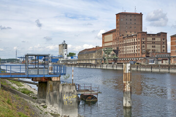 Karlsruhe, Germany: port of Karlsruhe with river rhine, ships, cranes and storage buildings