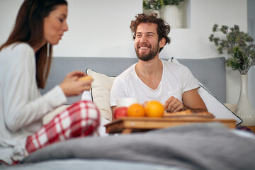 Girlfriend and boyfriend enjoying the breakfast together