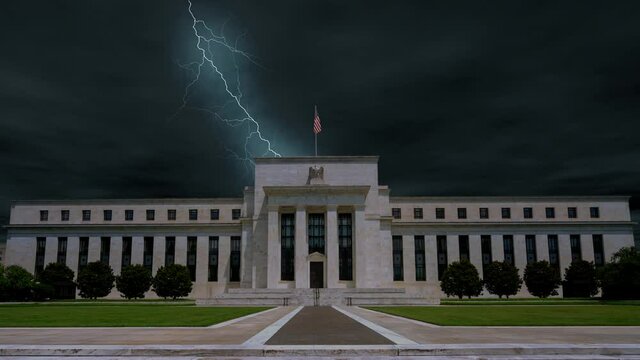 Dark and dramatic storm clouds with multiple lightning strikes over the Federal Reserve Board Building in Washington D.C. USA.