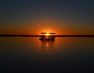 Fototapeta na wymiar boat river sunset