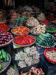 Hanoi, Vietnam, January 30, 2020 - View on a seller in the middle of a large assortment of row...