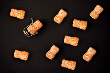 A few champagne or wine corks on a black background. Background and texture.