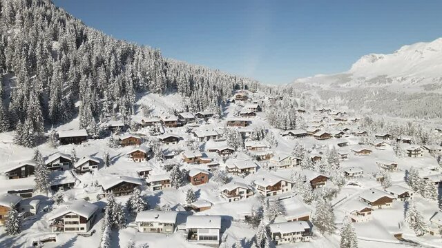 Snow covered village and mountains