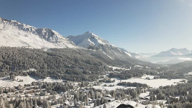 Snow covered village and mountains