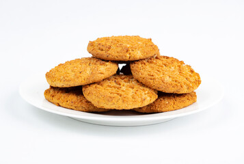 Fototapeta na wymiar Homemade oatmeal and nut cookies isolated on white background. 