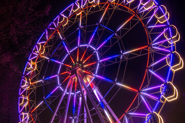 Ferris wheel at the fair ground at night.