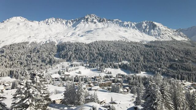 Snow covered village and mountains