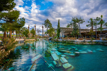 The Antique pool (Cleopatra's Bath) view in Pamukkale. It's a popular touristic destination during a Pamukkale visit