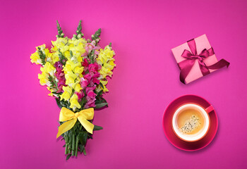 Beautiful flowers. A bouquet of bright flowers on a pink background. Copy space