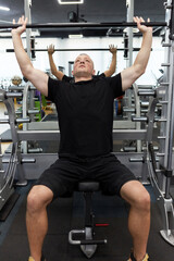 Man in the training gym  working hard after quarantine.