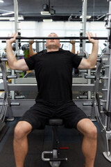 Man in the training gym  working hard after quarantine.