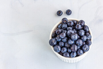 Fresh Blueberries in a Ramekin on White Background Horizontal Photo