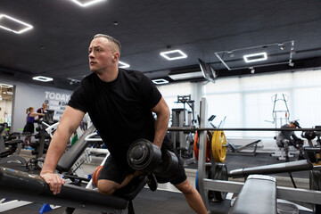 Man in the training gym  working hard after quarantine.