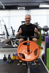 Man in the training gym  working hard after quarantine.