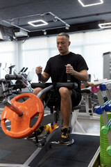Man in the training gym  working hard after quarantine.