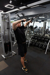 Man in the training gym  working hard after quarantine.