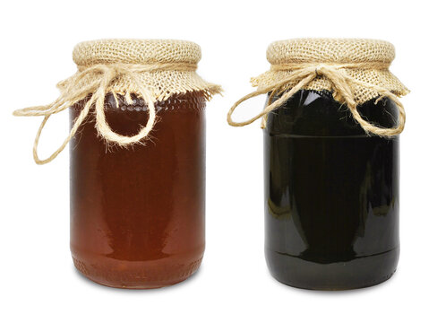 honeydew honey in a jar isolated on white