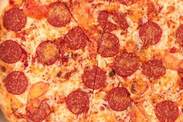 fresh aromatic hot Italian pepperoni pizza with mozzarella cheese in a cardboard box