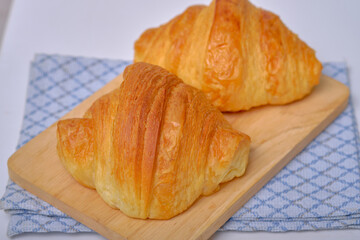 Warm Fresh Buttery Croissants and Rolls. French and American Croissants and Baked Pastries are enjoyed.