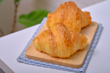 Warm Fresh Buttery Croissants and Rolls. French and American Croissants and Baked Pastries are enjoyed.