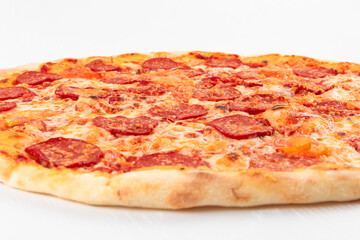 fresh aromatic hot italian pepperoni pizza with mozzarella cheese on white wooden table background