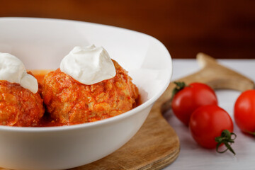  Meatballs with tomato sauce in plate on table