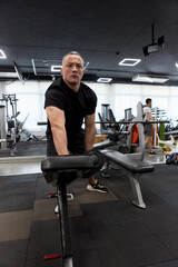 Man in the training gym  working hard after quarantine.