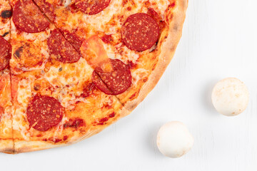 fresh aromatic hot pepperoni pizza with salami sausage and mushrooms on white background