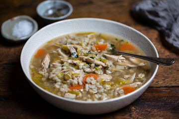 Comforting winter soup with chicken, pearl barley and vegetables
