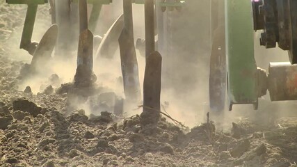 tillage in the field with a tractor with a machine