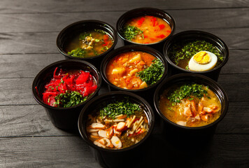 Business lunch in eco plastic container ready for delivery.Top view. Office Lunch boxes with food ready to go. Food takes away. Catering, brakfast