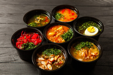 Business lunch in eco plastic container ready for delivery.Top view. Office Lunch boxes with food ready to go. Food takes away. Catering, brakfast