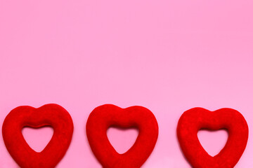 Three plush red hearts. Love concept. of Valentine's Day holiday. Place to place text
