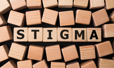 Word STIGMA made with wood building blocks